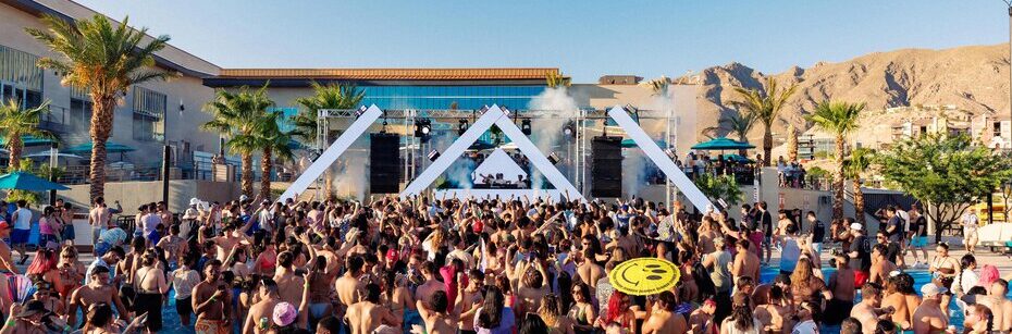 Crowd enjoying a daytime pool party concert at The Elmont Social Club in El Paso